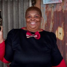 Soweto Gold '76: heroine with signed bottle